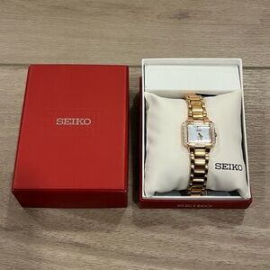 Seiko SUP212 Solar Rose Gold Tone Case Diamond White MOP Dial Womens Dress Watch